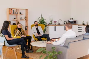 People talking together in a group counseling setting