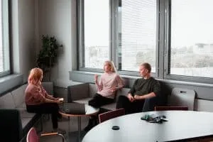 Couple talking with a therapist during an in-person couples therapy session