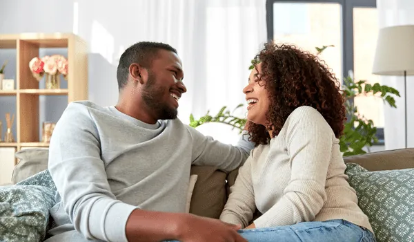 Couple talking warmly together at home