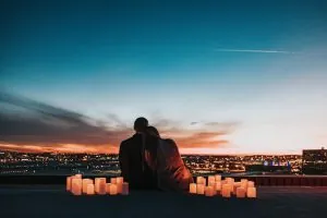 Couple watching the sunset together on a romantic date