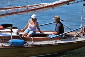 Relationship Drifting Apart Couple sitting apart on a sailboat, illustrating a relationship drifting apart