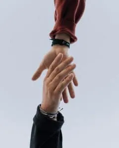 Hand reaching out to help another person