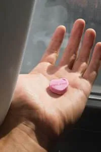 Small pink heart held in an open hand