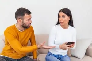 Man asking a woman for her phone