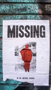 Missing-person notice on a wall