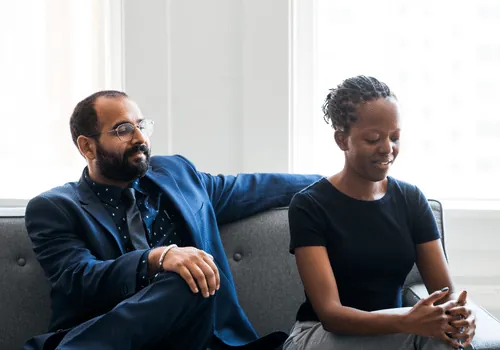 Couple sitting apart during relationship conflict