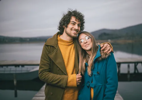 Couple together beside a lake