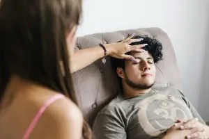 Therapist guiding a client through hypnosis during a counseling session