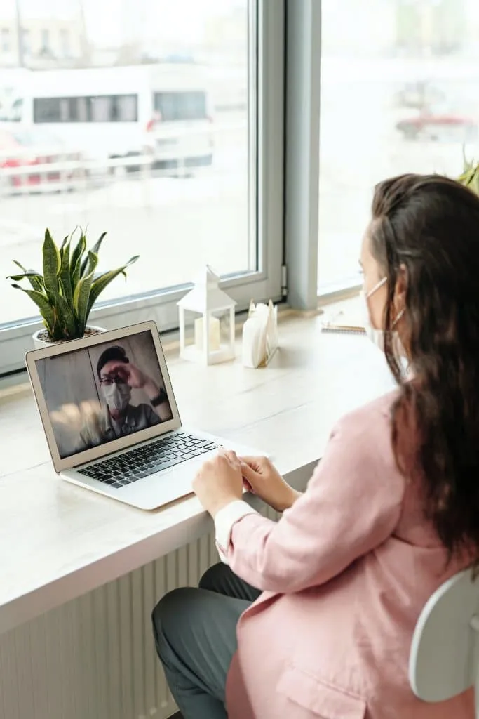 Therapist providing counseling by video call