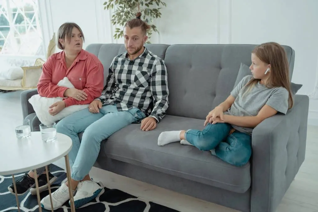 Family speaking with a counselor during a therapy session